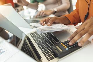 An accountant using a calculator